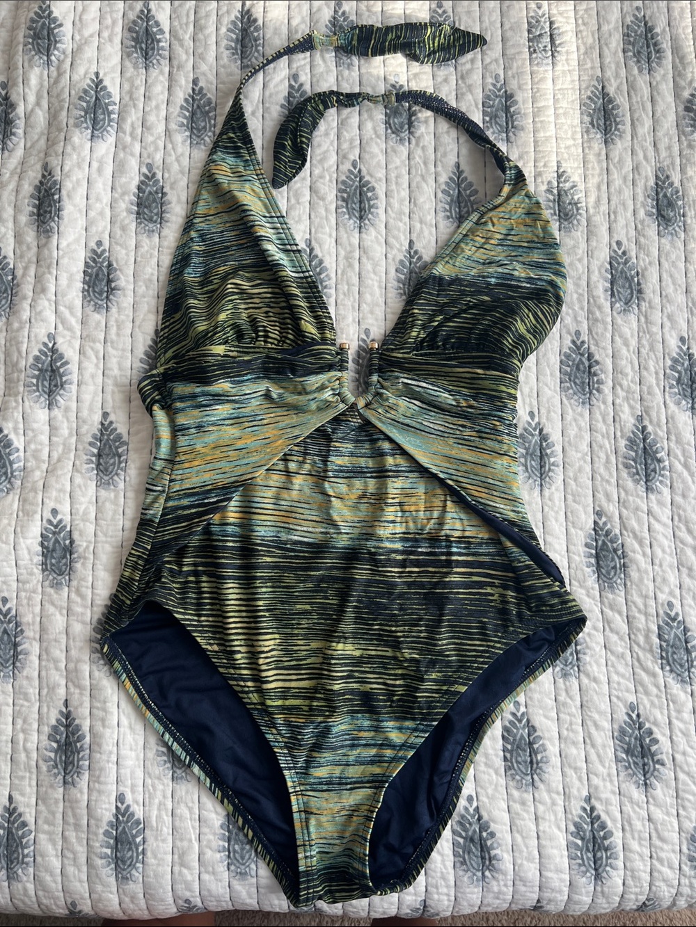 Vince Camuto deep plunge halter one piece.